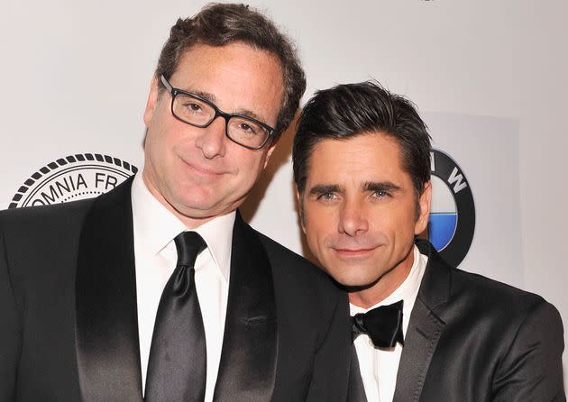 Bob Saget and John Stamos pictured together in 2013. (Photo: Stephen Lovekin via Getty Images)