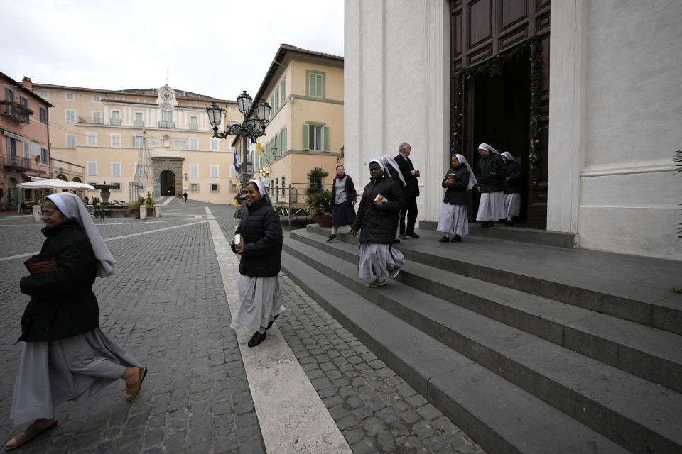 Nuns leaves the San Tommaso Da Villanova Parrish church in Castel Gandolfo, in the hills south of Rome, Tuesday Jan. 3, 2023. late Pope Emeritus Benedict XVI's death has hit Castel Gandolfo's "castellani" particularly hard, since many knew him personally, and in some ways had already bid him an emotional farewell on Feb. 28, 2013, when he uttered his final words as pope from the palace balcony overlooking the town square. (AP Photo/Alessandra Tarantino)