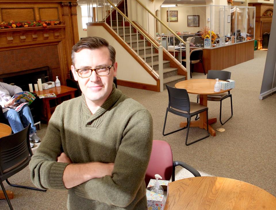 Nathan Watson, the new director for the Bedford Public Library, poses for a picture.