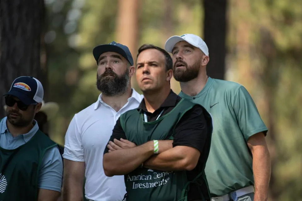 Jason, left, and brother Travis Kelce, right, watch the flight of a ball on the 4th tee in the first round of American Century celebrity golf championship on Friday, July 12, 2024, in Stateline, Nev.