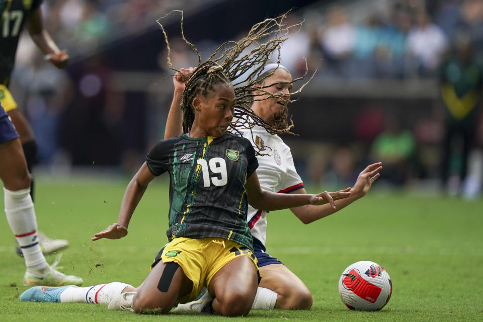 Jamaica's Tiernny Wiltshire (19) and United States' Sophia Smith fight for the ball during a CONCACAF Women's Championship soccer match in Monterrey, Mexico, Thursday, July 7, 2022. (AP Photo/Fernando Llano)