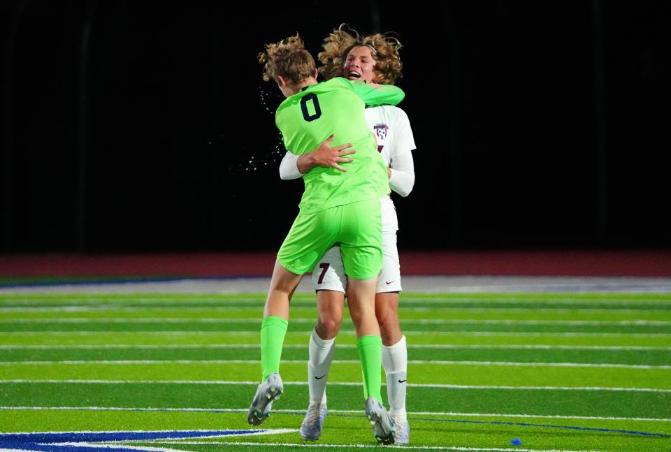 Perry goalkeeper Carson Pridie (0) hugs Caden Dosmann (7) after winning the 6A Championship game over San Luis at Dobson High School in Mesa on Feb. 25, 2023.