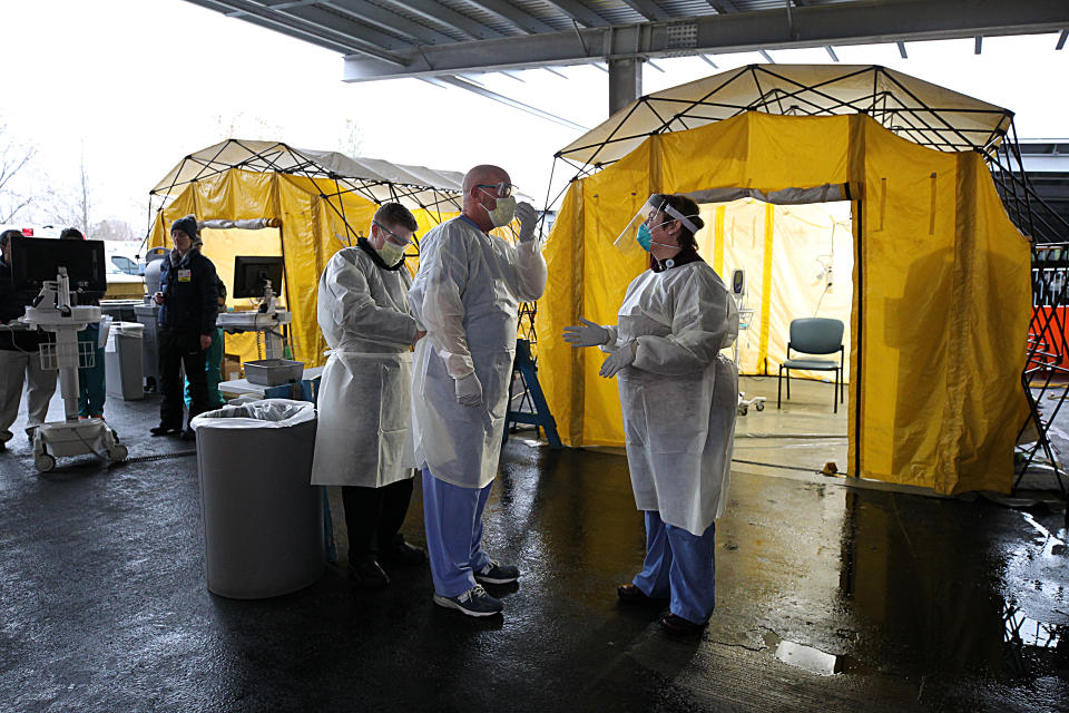 NEWTON, MA - MARCH 17: Medical professionals work in coronavirus testing tents at Newton Wellesley Hospital in Newton, MA on March 17, 2020. (Photo by Suzanne Kreiter/The Boston Globe via Getty Images)