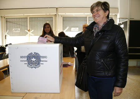 Italy's anti-establishment 5-Star Movement member Giuliana Di Pillo casts her ballot at a polling station in Ostia, Italy, November 19, 2017. Picture taken November 19, 2017. REUTERS/Yara Nardi