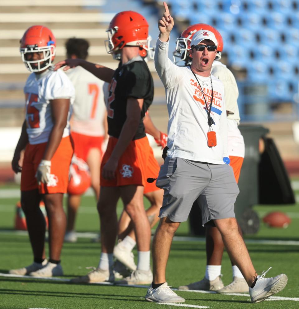 San Angelo Central High School head football coach Kevin Crane shouts instructions during the first preseason practice at San Angelo Stadium on Monday, Aug. 8, 2022.