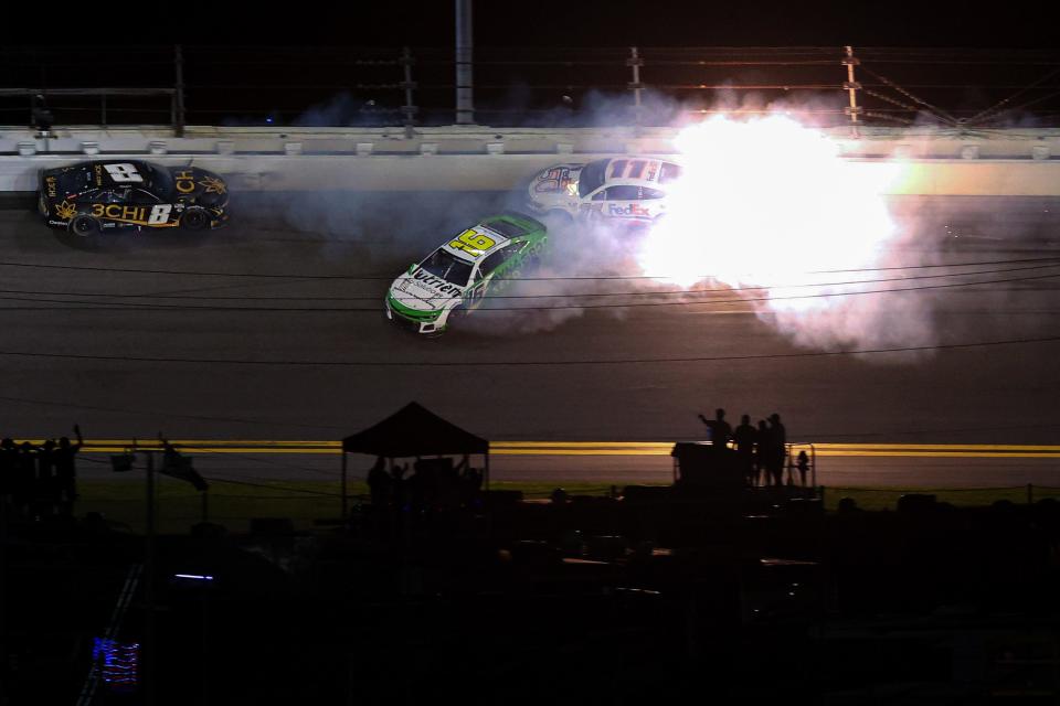 DAYTONA BEACH, FLORIDA - FEBRUARY 19: Denny Hamlin, driver of the #11 FedEx 50 Toyota, AJ Allmendinger, driver of the #16 Nutrien Ag Solutions Chevrolet, and Kyle Busch, driver of the #8 3CHI Chevrolet, spin after an on-track incident during the NASCAR Cup Series 65th Annual Daytona 500 at Daytona International Speedway on February 19, 2023 in Daytona Beach, Florida. (Photo by Mike Ehrmann/Getty Images)