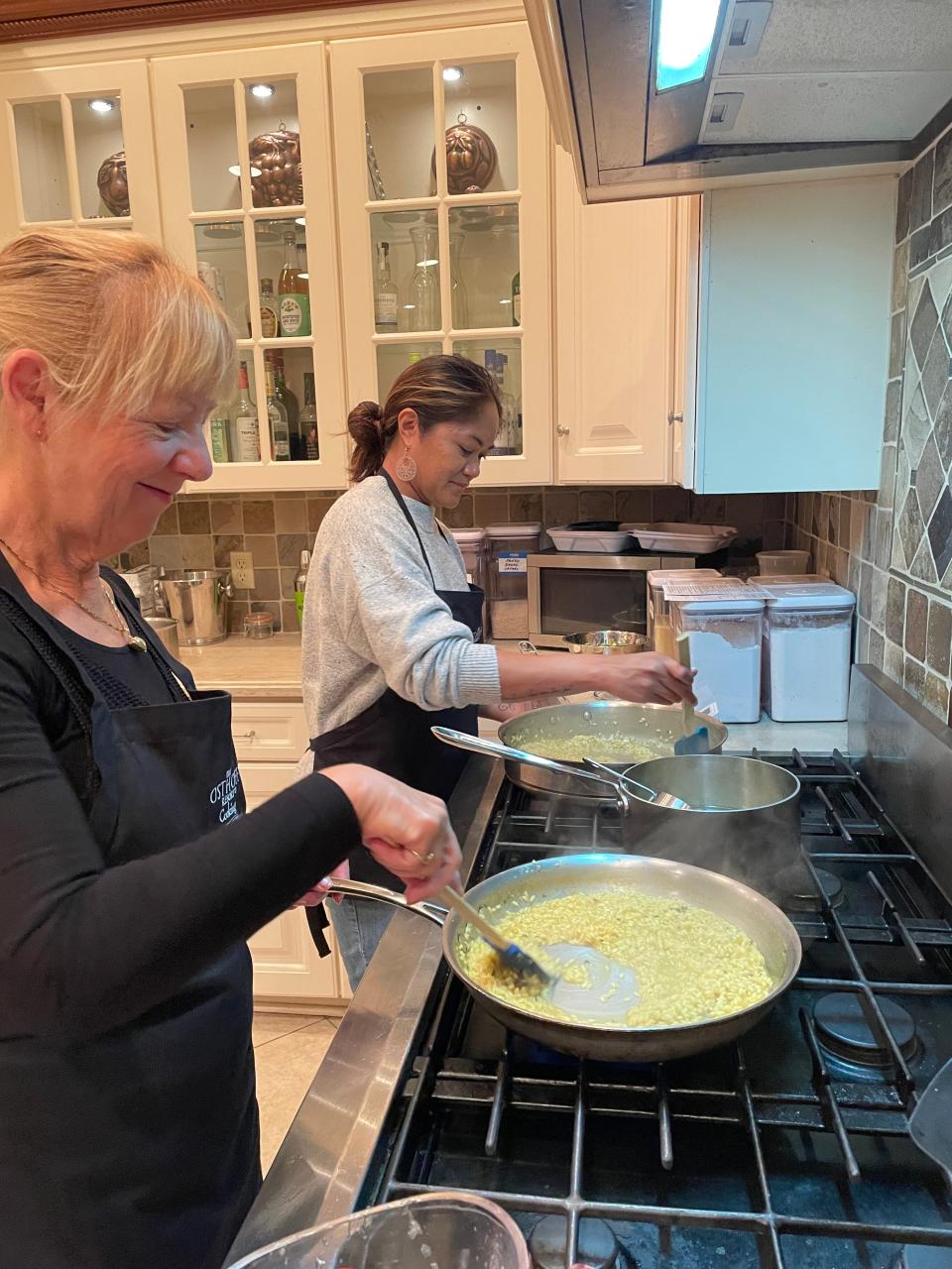 Students stir risotto during a cooking class at the Osthoff Resort in Elkhart Lake. The resort's Italian Night class is its most popular offering.