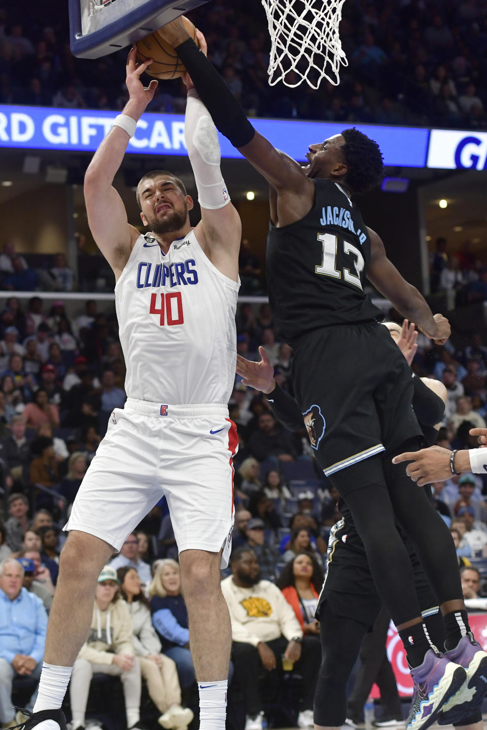 Los Angeles Clippers center Ivica Zubac (40) shoots against Memphis Grizzlies forward Jaren Jackson Jr. (13) in the second half of an NBA basketball game Friday, March 31, 2023, in Memphis, Tenn. (AP Photo/Brandon Dill)