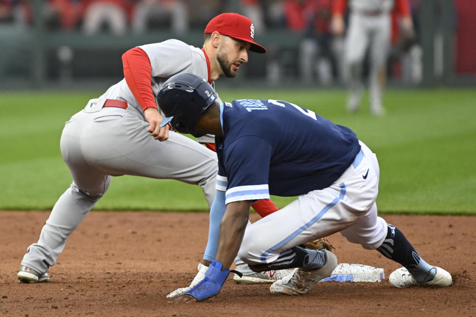 St. Louis Cardinals shortstop Paul DeJong, left, tags out Kansas City Royals' Michael A. Taylor during the third inning of a baseball game, Wednesday, May 4, 2022 in Kansas City, Mo. (AP Photo/Reed Hoffmann)