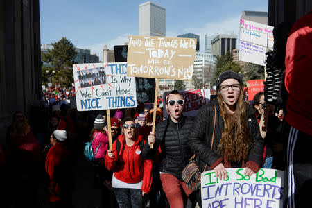 FILE PHOTO: Teachers, students and members of the community march toward the Denver Central Library, where contract negotiations between school district and teachers union officials continue, as Denver public school teachers strike for a second day in Denver, Colorado, U.S., February 12, 2019. REUTERS/Michael Ciaglo