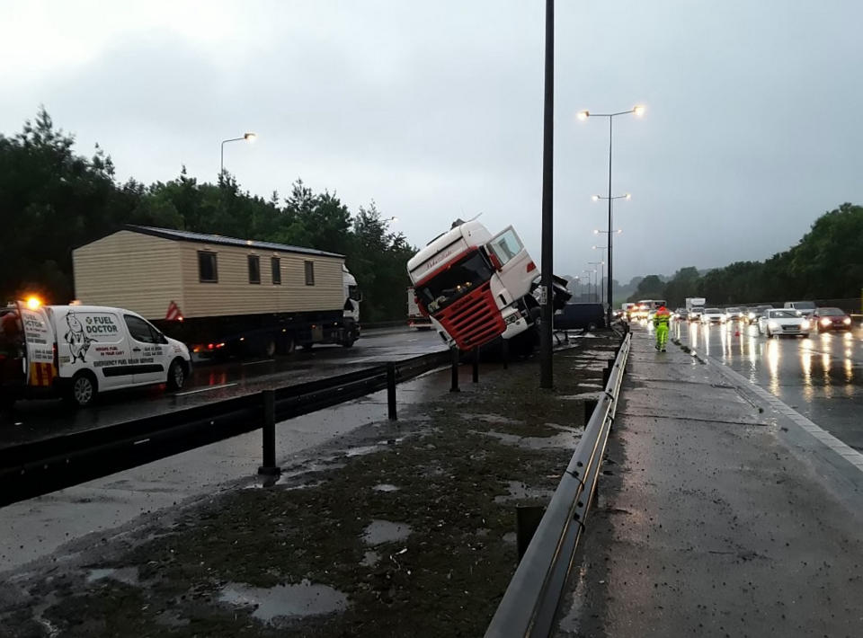 The wet weather led to a crash between Junction 7 and 8 on the M25, not far from where two sinkholes opened up (Picture: SWNS)