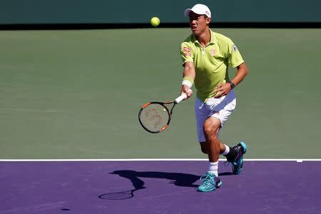 Mar 28, 2015; Key Biscayne, FL, USA; Kei Nishikori hits a forehand against Mikhail Youzhny (not pictured) on day six of the Miami Open at Crandon Park Tennis Center. Nishikori won 6-2, 6-1. Geoff Burke-USA TODAY Sports