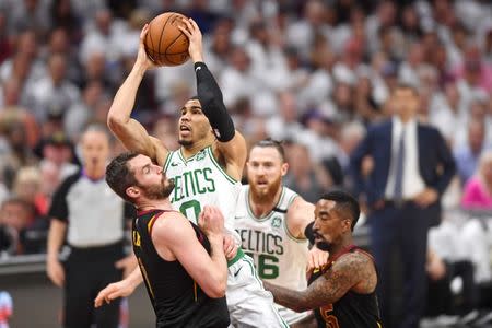 May 25, 2018; Cleveland, OH, USA; Boston Celtics forward Jayson Tatum (0) shoots the ball against Cleveland Cavaliers center Kevin Love (0) during the first quarter in game six of the Eastern conference finals of the 2018 NBA Playoffs at Quicken Loans Arena. Mandatory Credit: Ken Blaze-USA TODAY Sports