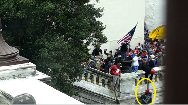 CCTV footage showing a man, identified as Joshua Youngerman, scaling the side of the U.S. Capitol building on Jan. 6, 2021 using a rope. (U.S. District Court Criminal Complaint)