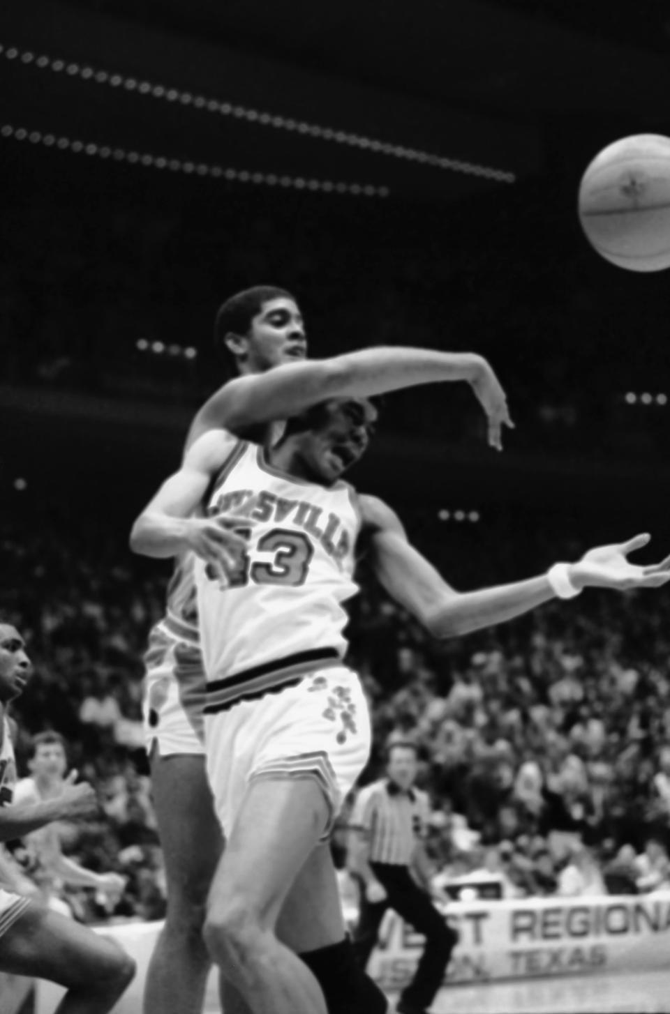 Pervis Ellison (43) of the Louisville Cardinals has the ball knocked away by Brad Daugherty (42) of the North Carolina Tar Heels during the second half of the NCAA West Regional game at Houston, March 20, 1986. AP Photo/Richard Carson