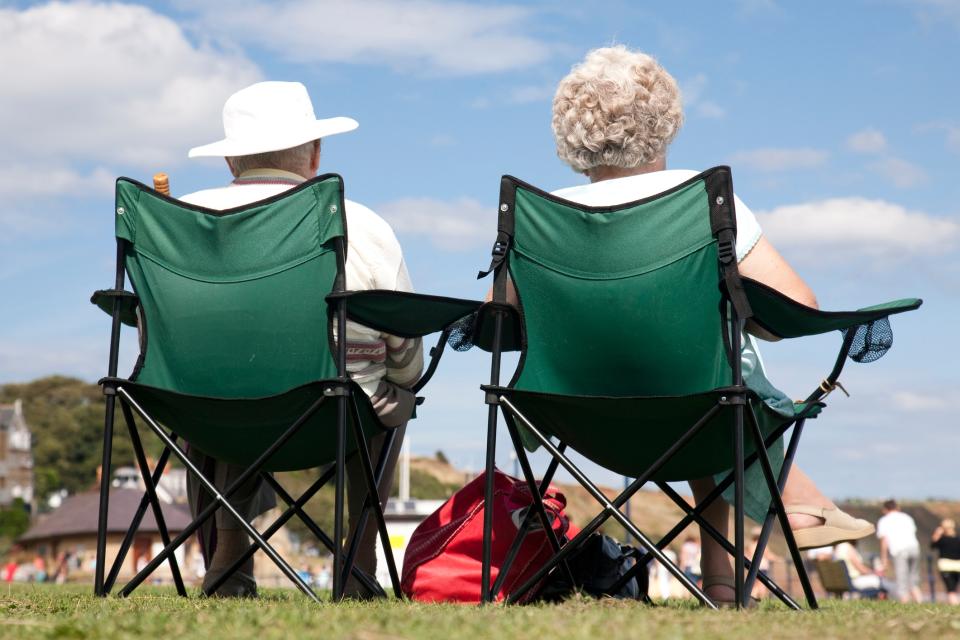 A couple soak up the sun in Filey - getty