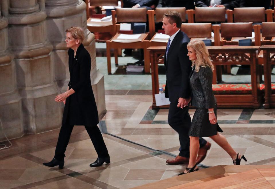 From l-r., Sen. Elizabeth Warren, D-Mass., Sen. Jeff Flake, R-Ariz., and his wife Cheryl Flake, arrive with other dignitaries and invited guests to attend a memorial service for Sen. John McCain, R-Ariz., at Washington National Cathedral in Washington, Saturday, Sept. 1, 2018. McCain died Aug. 25, from brain cancer at age 81. (AP Photo/Pablo Martinez Monsivais)