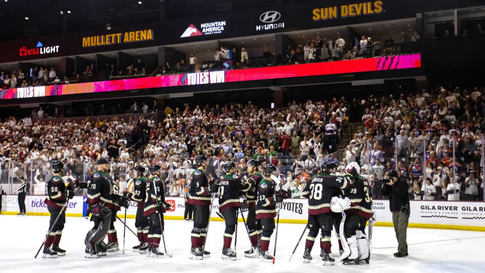 Arizona Coyotes players celebrate together on the ice after defeating the Edmonton Oilers 5-2 at Mullett Arena. - Mark J. Rebilas/USA TODAY Sports/Reuters