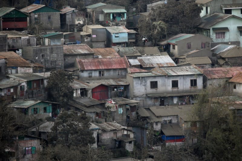 Houses covered in ash following Taal Volcano's eruption are pictured in Tagaytay City