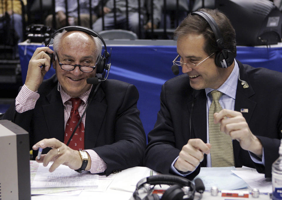 FILE - CBS announcers Billy Packer, left, and Jim Nantz laugh during a break in the championship game in the Big Ten basketball tournament in Indianapolis, March 12, 2006. Packer, an Emmy award-winning college basketball broadcaster who covered 34 Final Fours for NBC and CBS, died Thursday night, Jan. 26, 2023. He was 82. Packer's son, Mark, told The Associated Press that his father had been hospitalized in Charlotte, N.C., for the past three weeks and had several medical issues, and ultimately succumbed to kidney failure. (AP Photo/Michael Conroy, File)