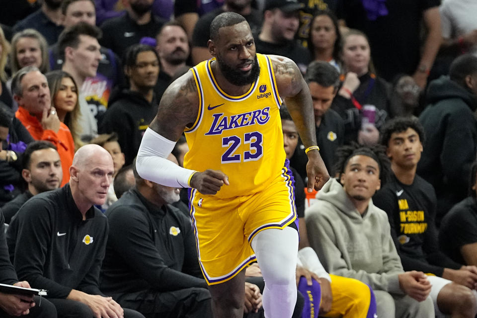 Los Angeles Lakers forward LeBron James (23) runs up court against the Phoenix Suns during the first half of an NBA basketball game, Friday, Nov. 10, 2023, in Phoenix. (AP Photo/Matt York)