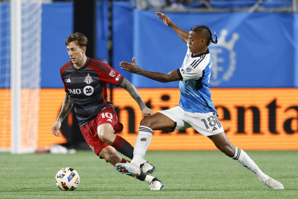 Toronto FC forward Federico Bernardeschi, left, and Charlotte FC forward Kerwin Vargas work for the ball during the second half of an MLS soccer match in Charlotte, N.C., Saturday, April 13, 2024. (AP Photo/Nell Redmond)