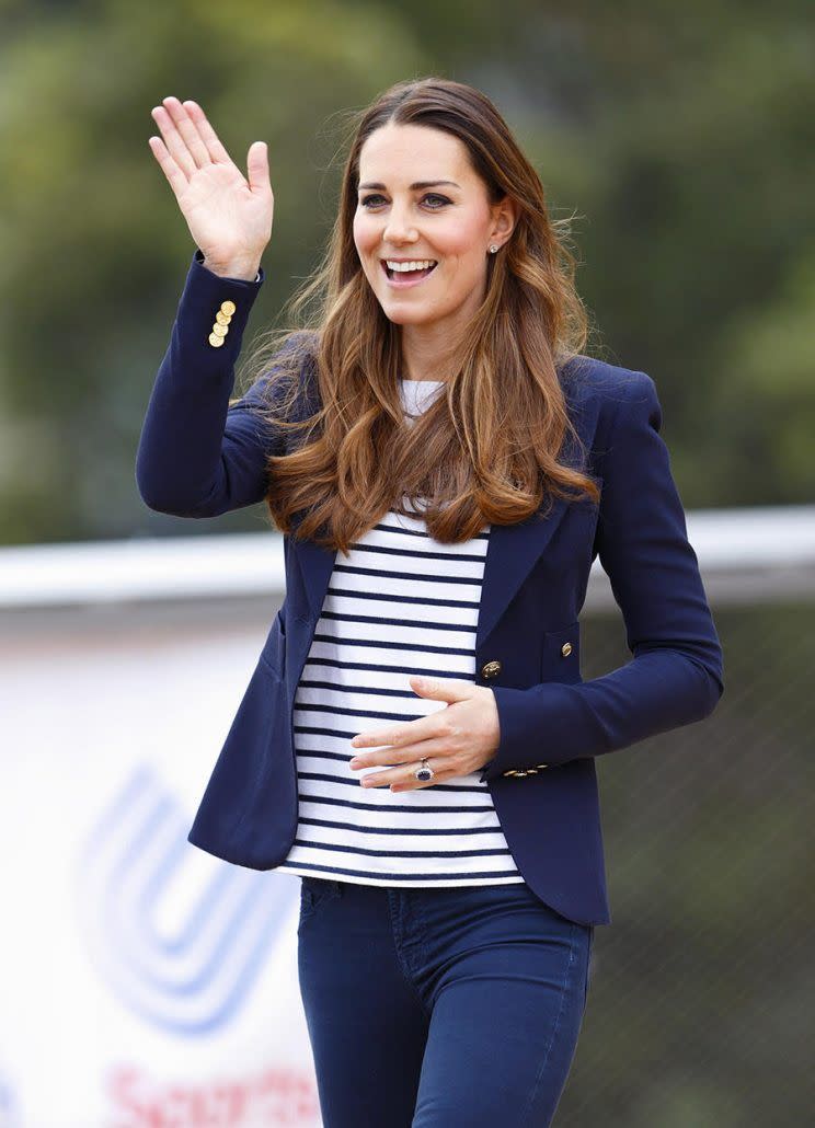 In 2013, while attending a SportsAid workshop at the Olympic Park in London, Kate wore a white-and-blue Ralph Lauren Tori Breton-striped top, blue Stuart Weitzman Corkswoon wedges, and her staple navy blue Smythe blazer. <em>(Photo: Getty)</em>