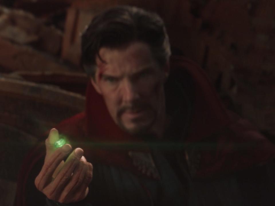 Doctor Strange holds the glowing green infinity gem in "Avengers: Infinity War."