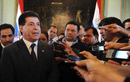 El presidente de Paraguay Horacio Cartes durante una rueda de prensa en Asunción, Paraguay, el 19 de diciembre del 2013 (AFP | Norberto Duarte)