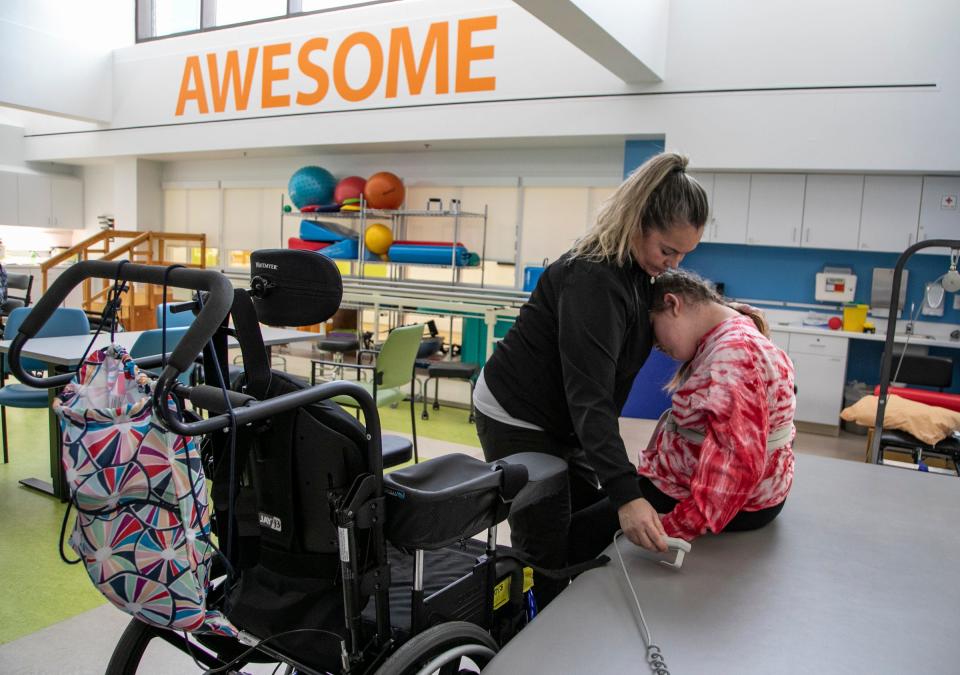 Physical therapist assistant Starr Sutton works with Savanah DeHart, 15, during an afternoon rehabilitation segment at the Mary Free Bed Rehabilitation Hospital in Grand Rapids Thursday, Jan. 23, 2020 to treat the debilitating effects of the Triple E (Eastern Equine Encephalitis) virus. DeHart was likely bitten by a an infected mosquito last summer and suffered stroke-like symptoms.