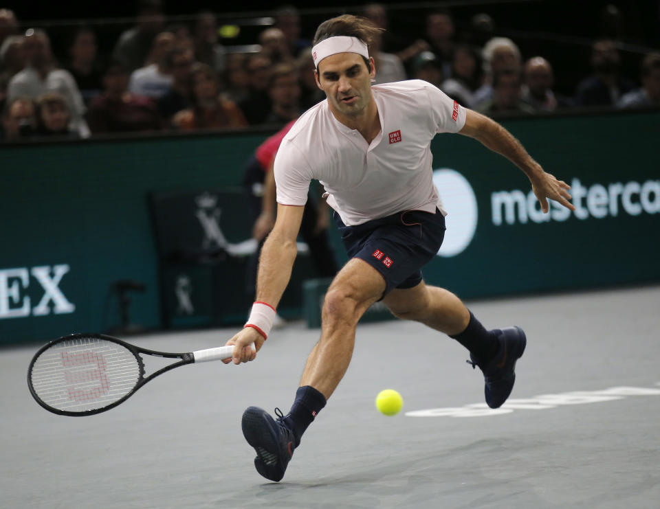 Roger Federer of Switzerland returns the ball to Kei Nishikori of Japan during their quarterfinal match of the Paris Masters tennis tournament at the Bercy Arena in Paris, France, Friday, Nov. 2, 2018. (AP Photo/Michel Euler)