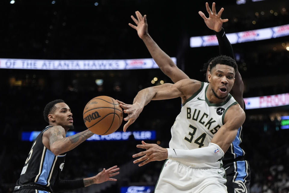 Milwaukee Bucks forward Giannis Antetokounmpo (34) passes the ball against the Atlanta Hawks during the second half of an NBA basketball game, Saturday, March 30, 2024, in Atlanta. (AP Photo/Mike Stewart)