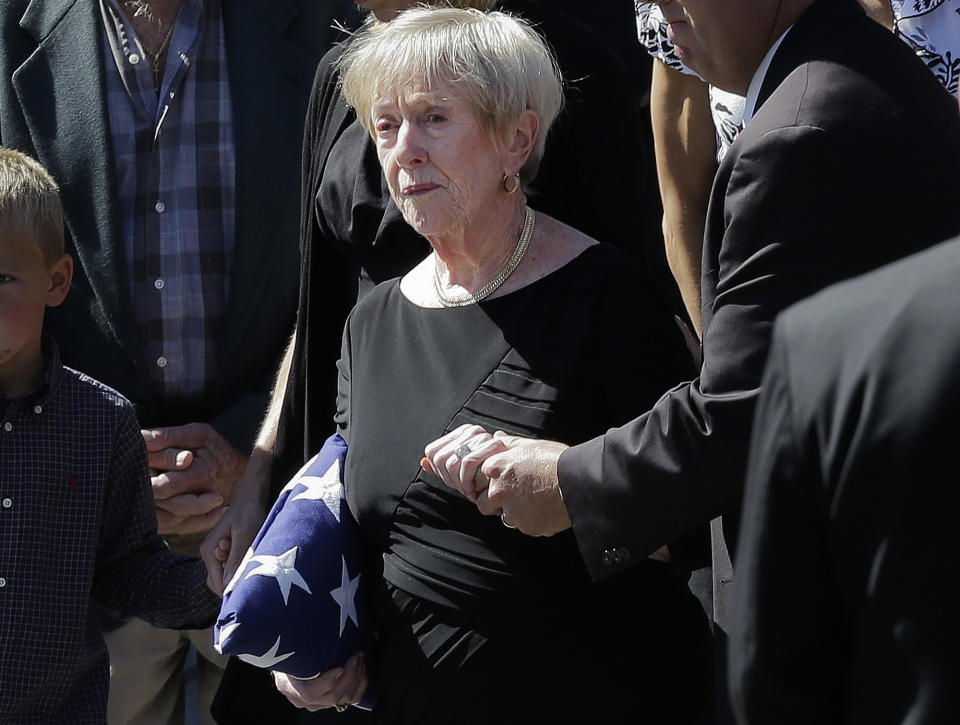 This photo taken Sept. 19, 2012 shows Barbara Doherty, mother of slain former Navy SEAL Glen Doherty, escorted from the Church of St. Eulalia in Winchester, Mass., after his funeral. What do a Navy mom, Big Bird and AARP have in common? They all want President Barack Obama and Republican Mitt Romney to leave them alone. The two candidates are drawing on personal stories and pop culture references in campaign ads, daily speeches and debate zingers as each seeks to cast himself as an “everyman” and broaden his appeal in the presidential race's closing weeks. But they're encountering resistance at seemingly every turn by a broad collection of people they mention and entities they reference. And this year, the complaints go beyond those that usually occur during campaign years: griping by musical groups whose songs candidates use at rallies. (AP Photo/Elise Amendola)