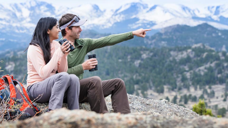 Person using Nikon Prostaff binoculars