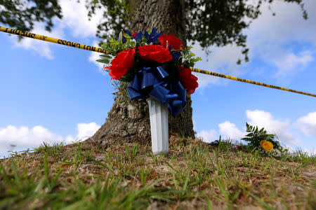 Flowers are left in memory of the victims killed in a shooting at the Santa Fe High School in Santa Fe, Texas, U.S., May 19, 2018. REUTERS/Jonathan Bachman