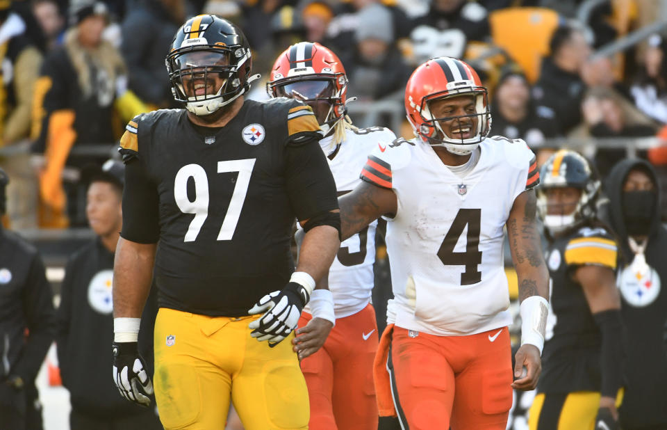 Jan 8, 2023; Pittsburgh, Pennsylvania, USA; Cleveland Browns quarterback Deshaun Watson (4) shares a laugh with Pittsburgh Steelers defensive end Cameron Heyward (97) during the third quarter at Acrisure Stadium. Mandatory Credit: Philip G. Pavely-USA TODAY Sports
