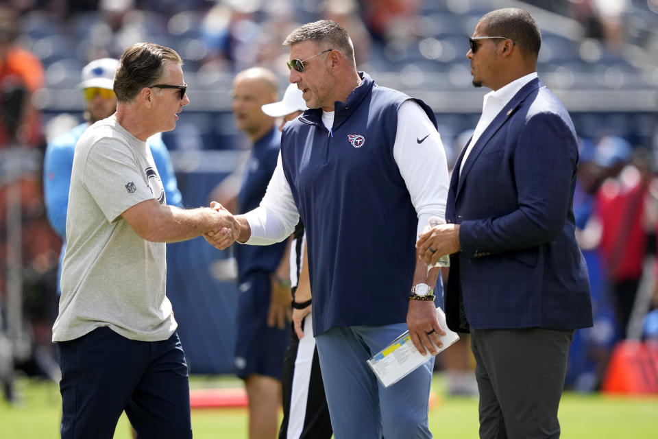 Chicago Bears head coach Matt Eberflus, left, greets Tennessee Titans head coach Mike Vrabel as Bears general manager Ryan Poles looks on prior to an NFL preseason football game, Saturday, Aug. 12, 2023, in Chicago. (AP Photo/Charles Rex Arbogast)
