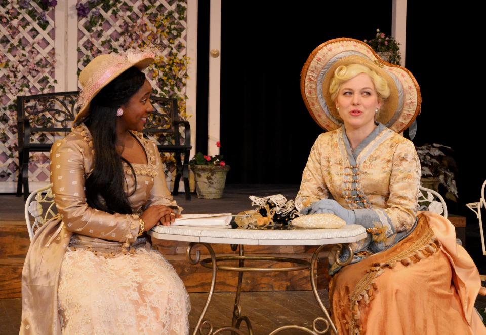Maya Nicholson, left, and Tess Burgler play Cecily and Gwendolyn in "The Importance of Being Earnest" at Ohio Shakespeare Festival in Akron.