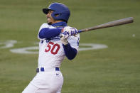 Los Angeles Dodgers' Mookie Betts flies out during the first inning of the team's baseball game against the Arizona Diamondbacks on Thursday, Sept. 3, 2020, in Los Angeles. (AP Photo/Marcio Jose Sanchez)