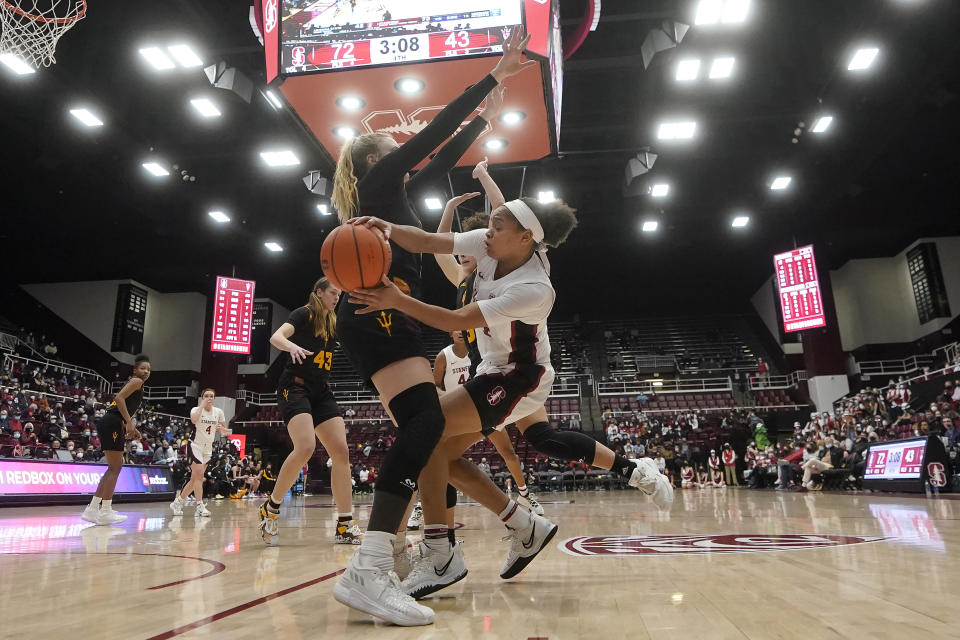Stanford guard Jordan Hamilton, right, passes the ball while being defended by Arizona State guard Sydney Erikstrup during the second half of an NCAA college basketball game in Stanford, Calif., Friday, Jan. 28, 2022. (AP Photo/Jeff Chiu)