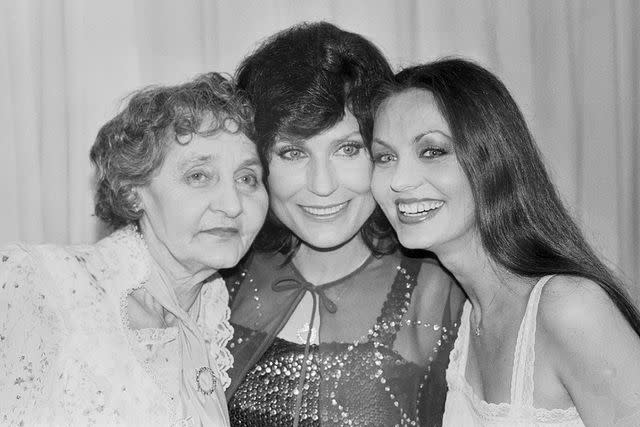 <p>Getty</p> Buena Park, California: "Country" Family. Here's a kind of royal family of country music. Loretta Lynn (Center) poses with her mother, Clara Butcher, and sister, Crystal Gayle, at the 15th annual "Academy of Country Music Awards" ceremonies at Knott's Berry Farm May 1.