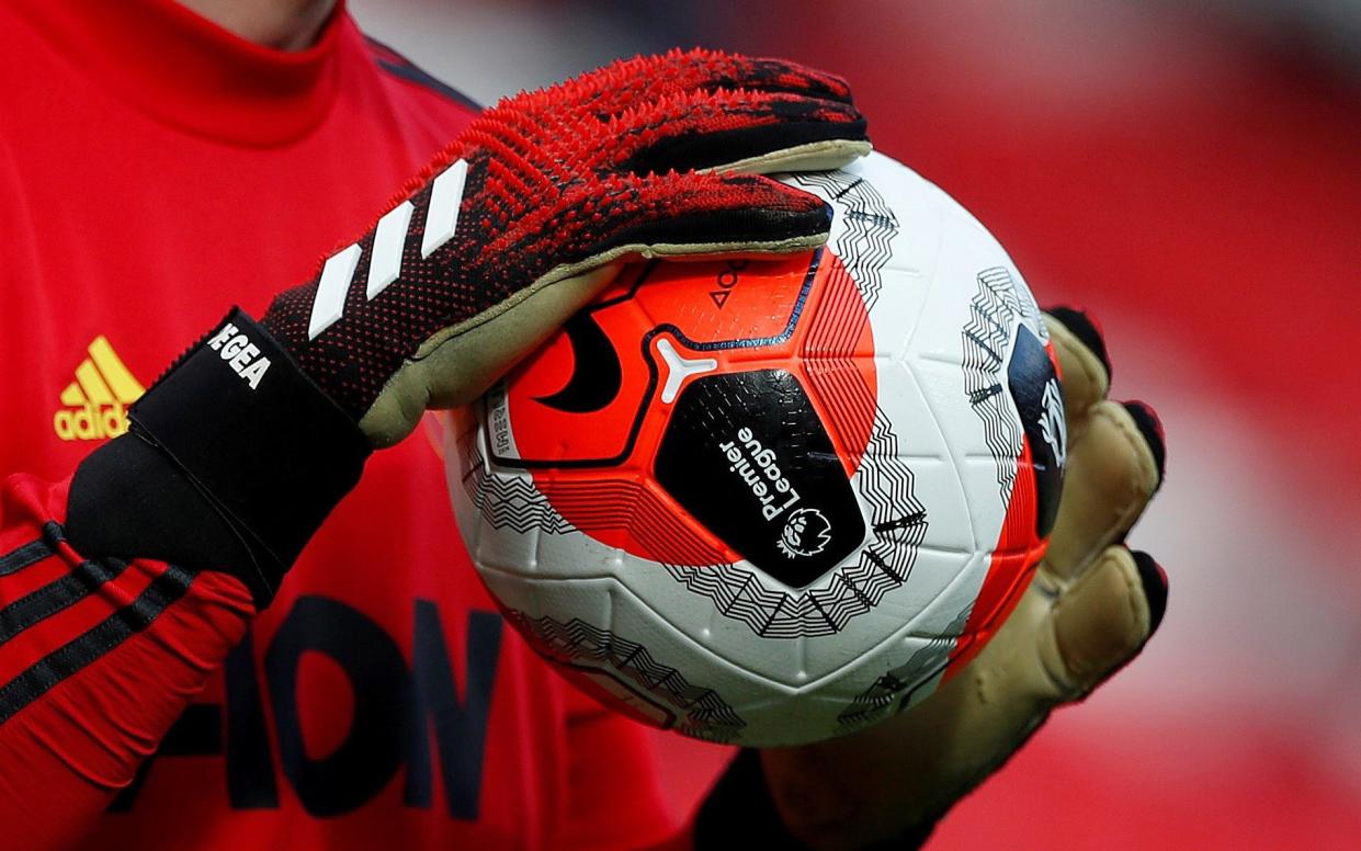 General view of a match ball held by Manchester United's David de Gea - ACTION IMAGES