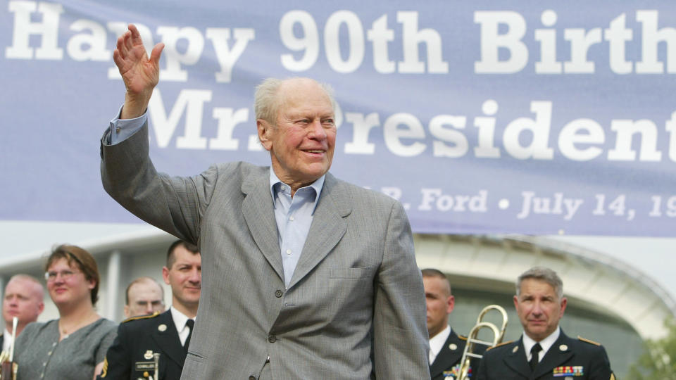 FORD Former President Gerald Ford waves to the crowd as he is introduced during a 90th birthday celebration, in Grand Rapids, Mich.