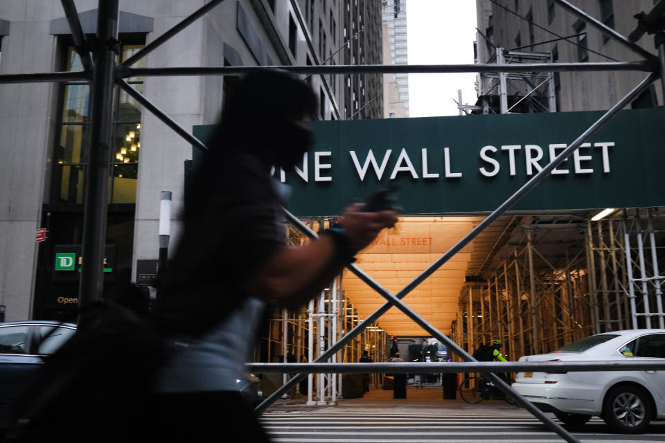 NEW YORK, NEW YORK - OCTOBER 02: People walk by the New York Stock Exchange (NYSE) in lower Manhattan on October 02, 2020 in New York City. Stocks and markets around the world have fallen in morning trading as investors digest the overnight news that President Donald Trump has Covid-19. (Photo by Spencer Platt/Getty Images)