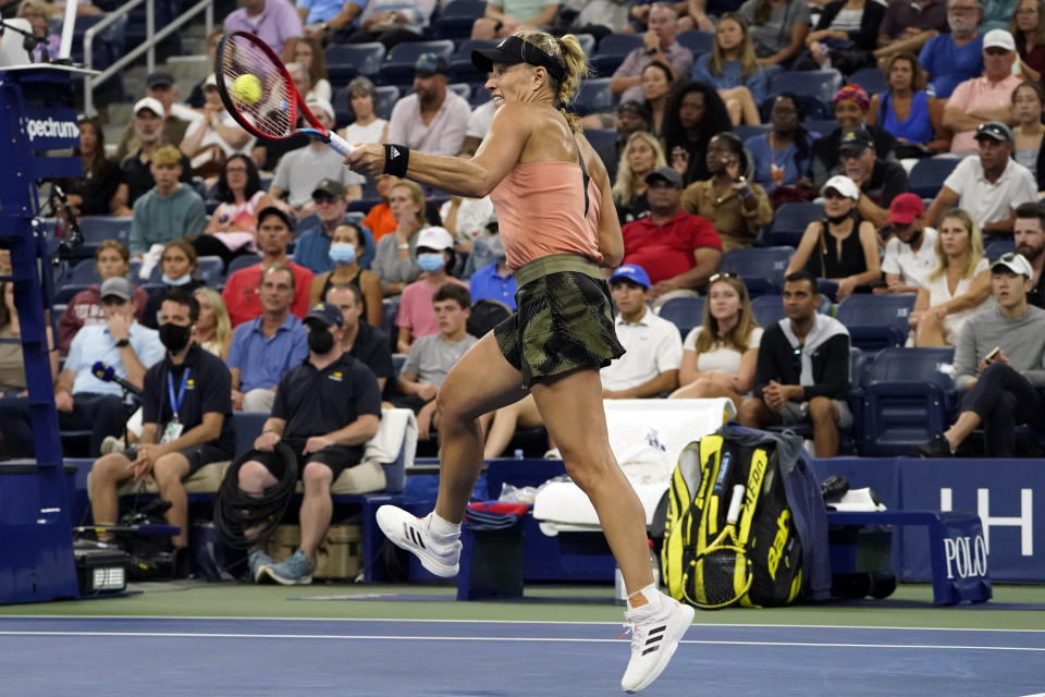Angelique Kerber, of Germany, returns to Leylah Fernandez, of Canada, during the fourth round of the US Open tennis championships, Sunday, Sept. 5, 2021, in New York. (AP Photo/John Minchillo)