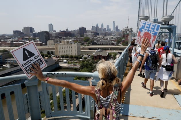 Demonstrators make their way to downtown on the Benjamin Franklin Bridge in Philadelphia on Monday, during the first day of the Democratic National Convention. Alex Brandon / AP
