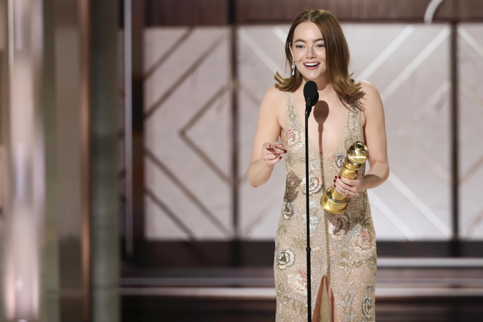 ADDS COMEDY OR MUSICAL TO THE CATEGORY - This image released by CBS shows Emma Stone accepting the award for best female actor in a motion picture comedy or musical for her role in "Poor Things" during the 81st Annual Golden Globe Awards in Beverly Hills, Calif., on Sunday, Jan. 7, 2024. (Sonja Flemming/CBS via AP)