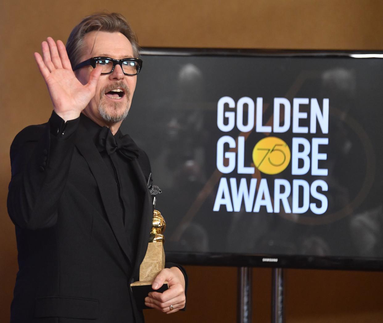 Actor Gary Oldman poses with the trophy for Best Performance by an Actor in a Motion Picture - Drama during the 75th Golden Globe Awards on January 7, 2018, in Beverly Hills, California. / AFP PHOTO / Frederic J. BROWN        (Photo credit should read FREDERIC J. BROWN/AFP via Getty Images)