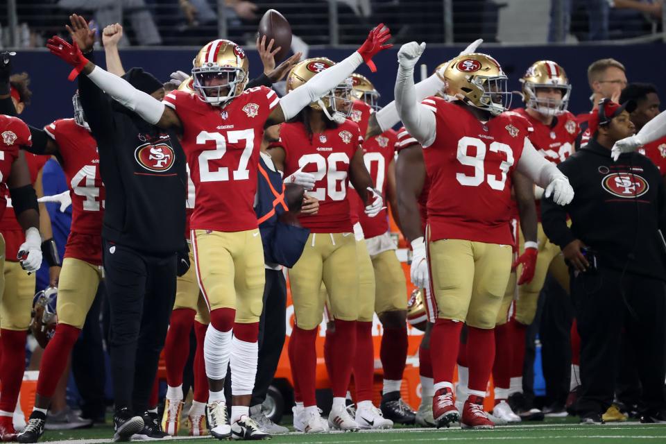 49ers defensive back Dontae Johnson (27) and teammates celebrate during Sunday's game in Dallas.