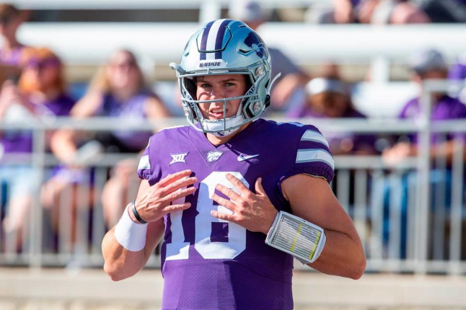 Kansas State Wildcats quarterback Will Howard (18) adjusts his shoulder pads before a game against the South Dakota Coyotes at Bill Snyder Family Football Stadium on Sept. 3, 2022.